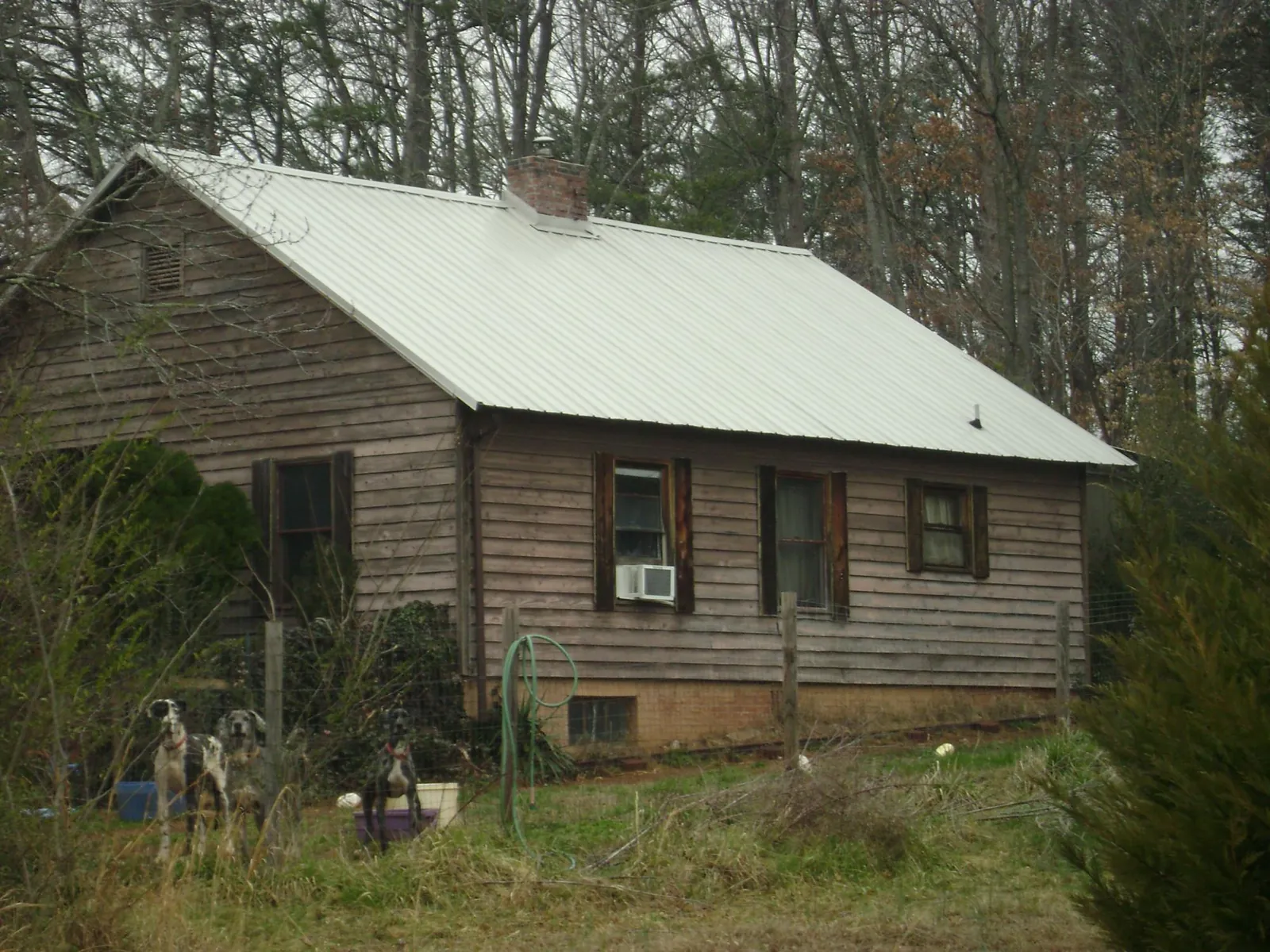 White metal roof on an old wood sided farmhouse, from a Metal Roof Installation job in Newmanstown